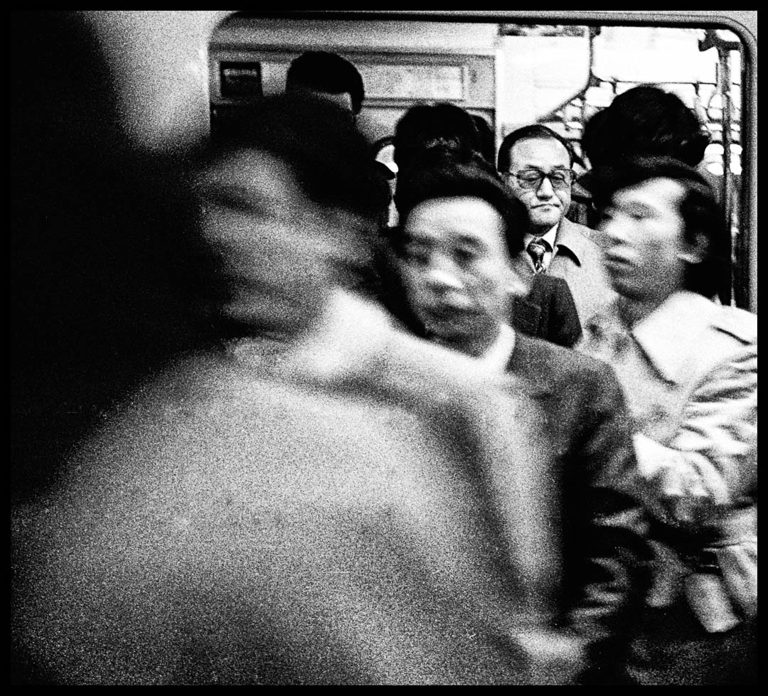 Workday commuters exiting train at Shinjuku Station, Tokyo, in 1975.