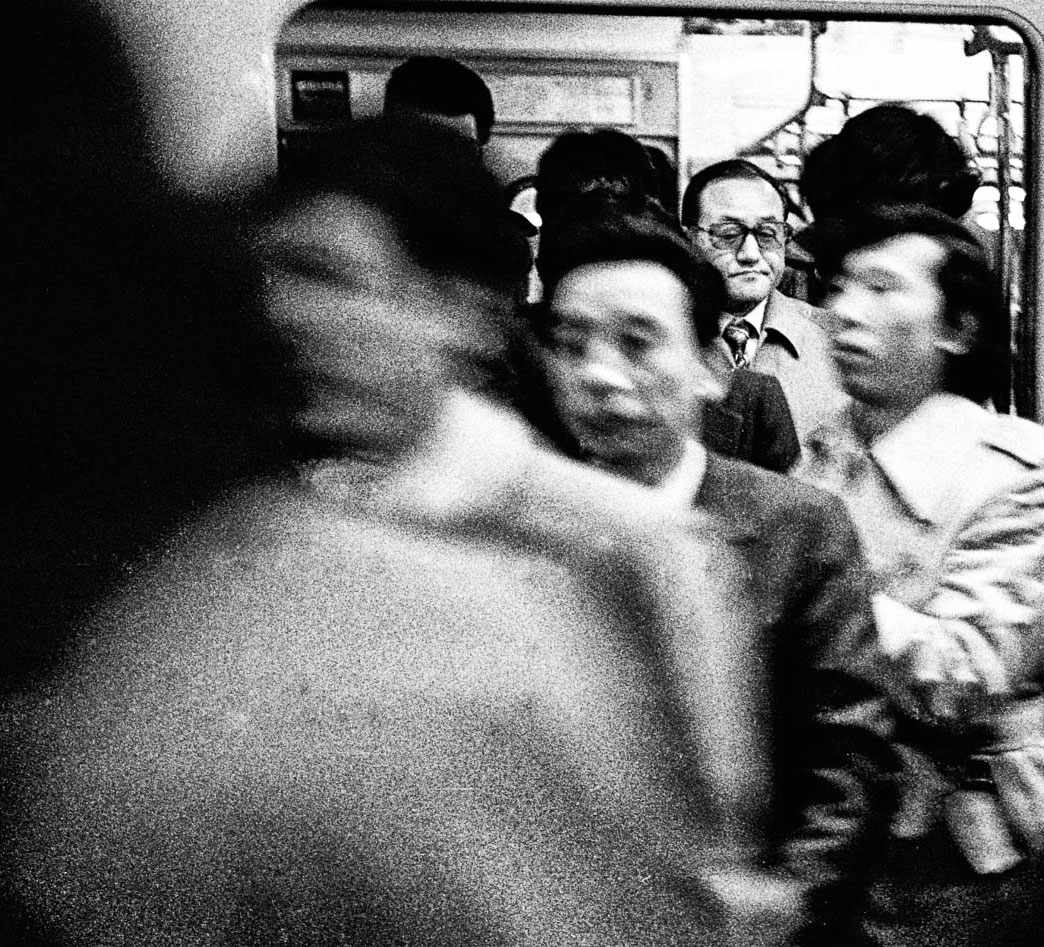 Workday commuters exiting train at Shinjuku Station, Tokyo, in 1975.