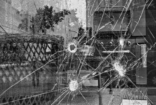 A downtown Oakland store window in 2010 on the morning after a previous night's protest march turned violent. 